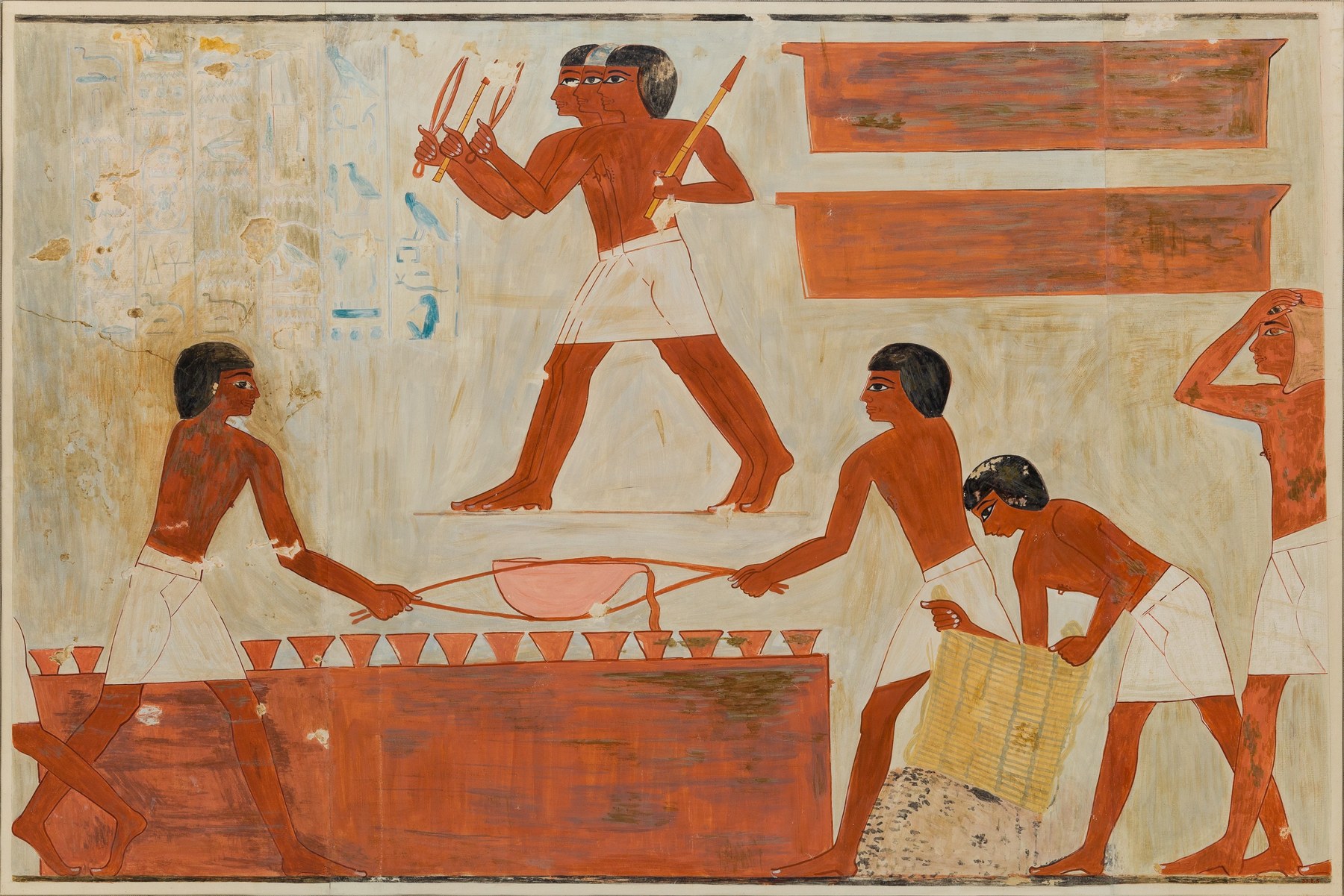 Escena de fundición y vaciado de cobre en la tumba de Rekhmire (c. 1450 a.C.) — los obreros funden el metal, lo cargan, lo vierten en moldes y trabajan los fuelles con los pies